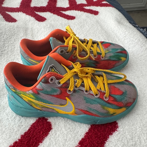 Nike Kids' Shoes with Orange and Teal Accents